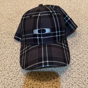 Oakley plaid cap hat Small/medium per tag. Black. Gray. Blue (slight) nice hat